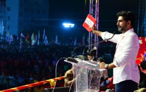 TDP scion Nara Lokesh showing the 'red book' with YSRCP supporting IAS and IPS officers name recorded. (Supplied)