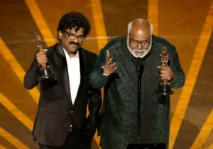 Chandrabose with MM Keeravani on the Oscars stage