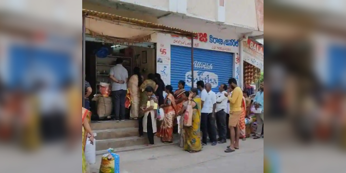 Residents lining up at a fair price shop to avail the subsidised food.