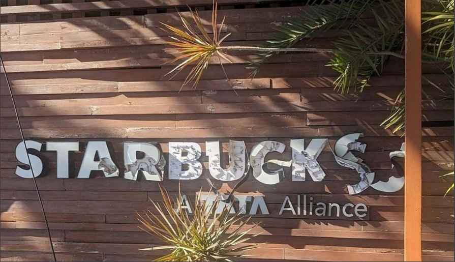 Vandalised name board of Starbucks