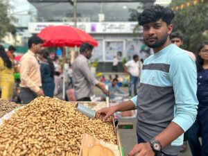 Karthik from Salem is debuting at the festival with his homegrown groundnuts. (South First/Rama Ramanan)