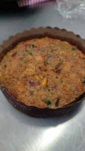 The plum cake mixture has undergone a month-long soaking process and is now ready for baking and delivery. (Mugil's Delight)