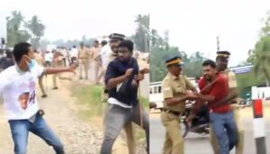 Television images of police helping DYFI workers attack protestors. Photo: Asianet.
