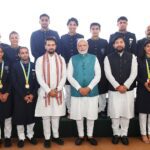 Mohammed Hussamuddin with his bronze medal (bottom most right) and the Indian boxing contingent with PM Narendra Modi after returning from the 2022 Birmingham CWG. (Supplied)
