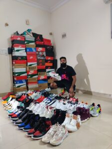 James Raleigh Thomas with his sneaker collection. (Supplied)