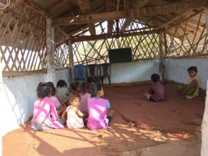 The children playing in around school posed for a picture. 