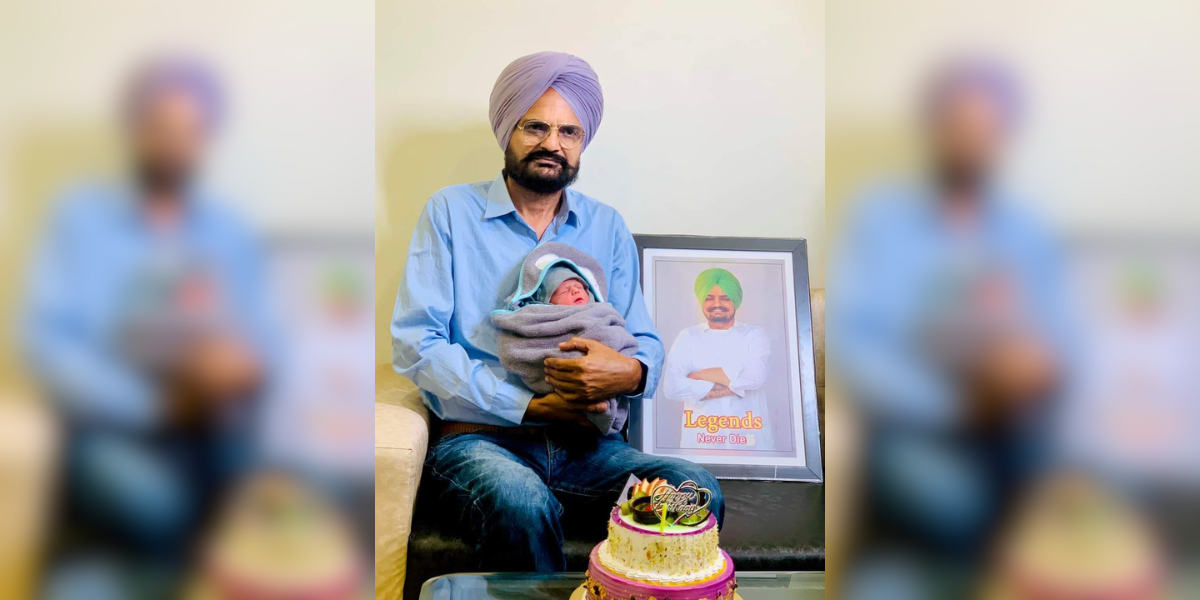 Balkaur Singh with his newborn baby and a picture of his late son Sidhu Moose Wala. (X)
