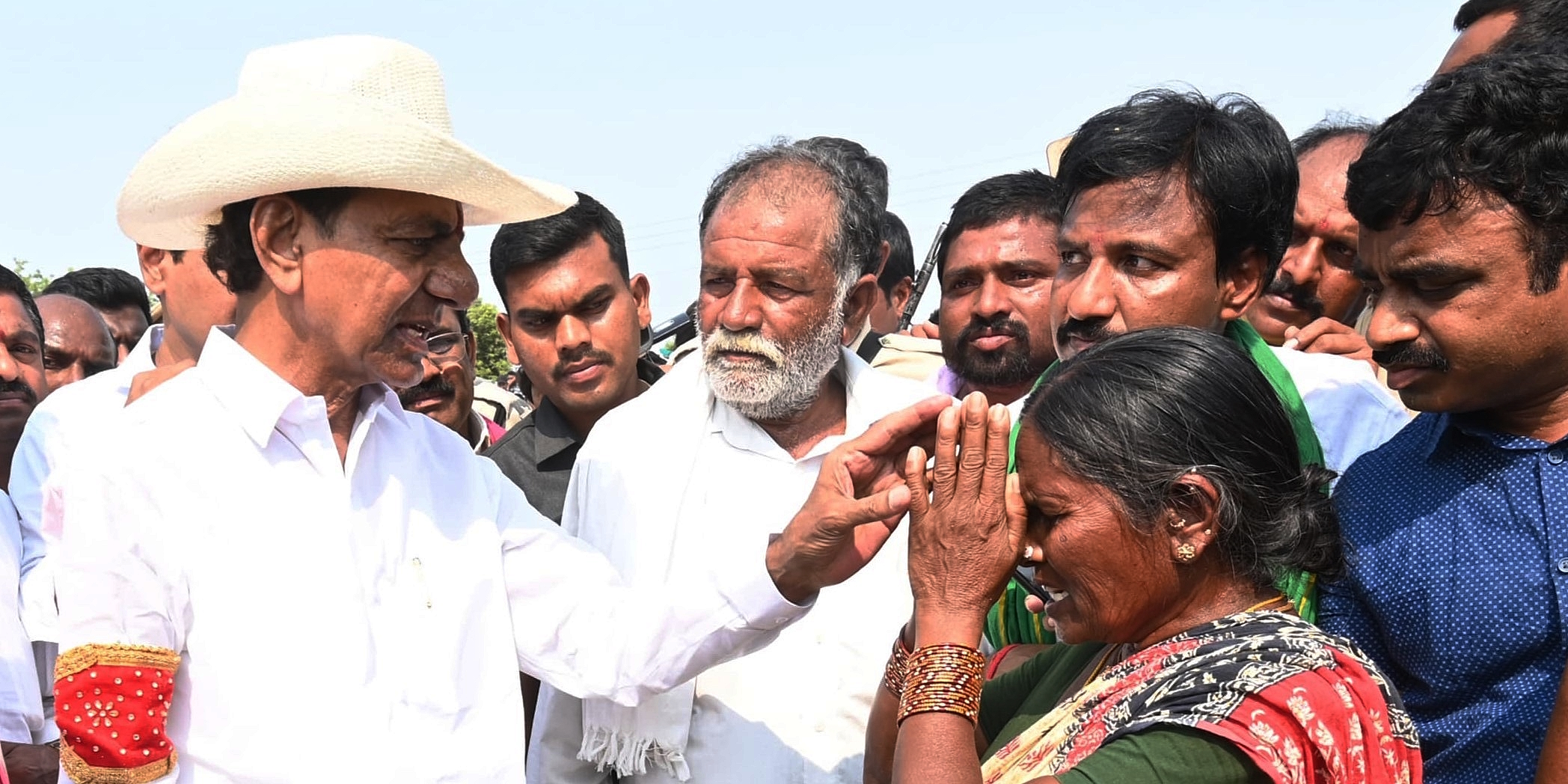 BRS chief K Chandrashekar Rao with farmers in Telangana on Sunday, 31 March, 2024.