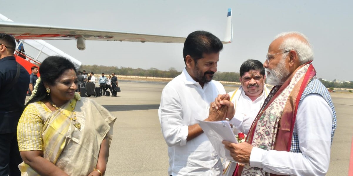 Telangana Chief Minister A Revanth Reddy with Prime Minister Narendra Modi in Telangana on Monday, 4 March, 2024, as Governor Tamilisai Soundararajan looks on.