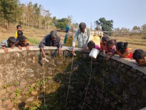 The children, and the elders are taking out the water from the bore wall. 