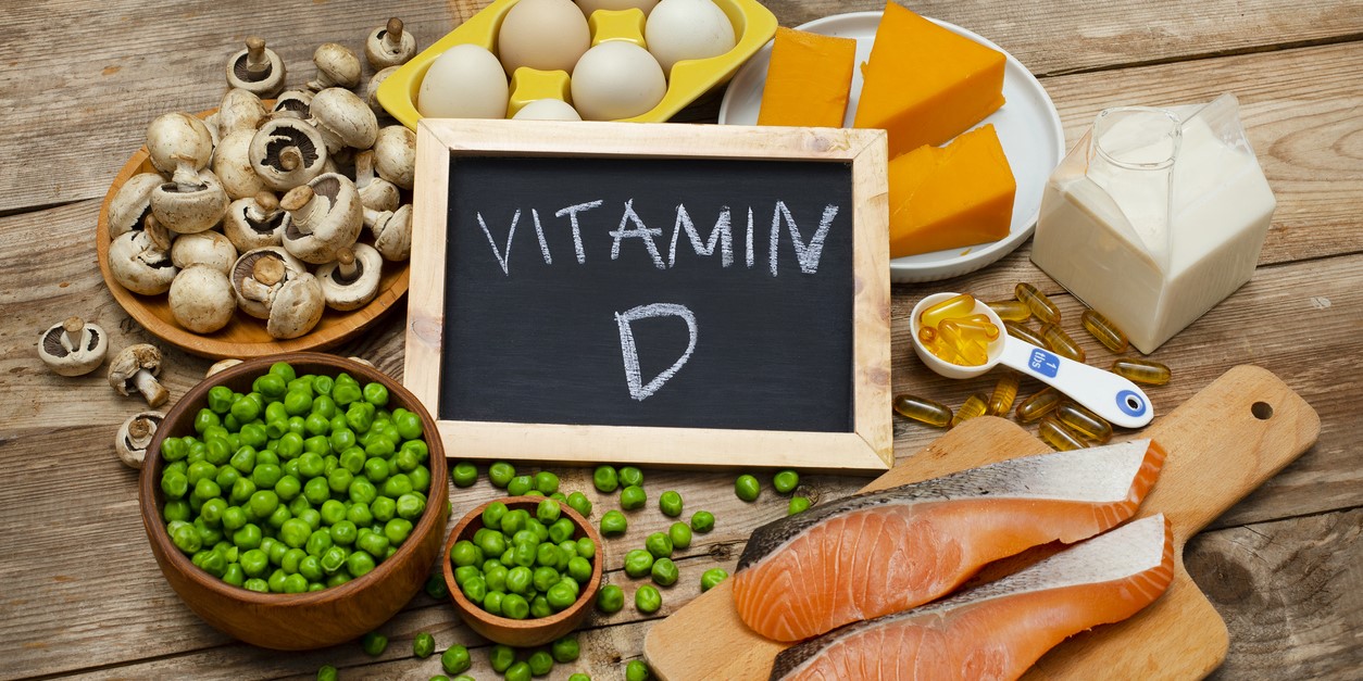 Foods rich in vitamin D on a wooden table. (iStock)