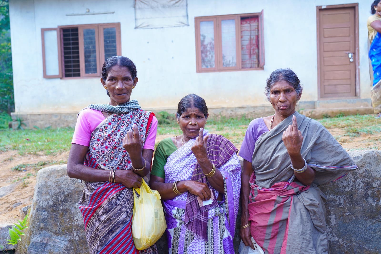 Tribeswomen of Idamalakkudi pose for a photograph after casting their votes on Friday. Idamalakkudi (also Edamalakkudi) is a remote tribal village located between the Idamalayar Forest Reserve and Mankulam Forest Division in Idukki. Muthuvans are the only tribe living in the hamlet.