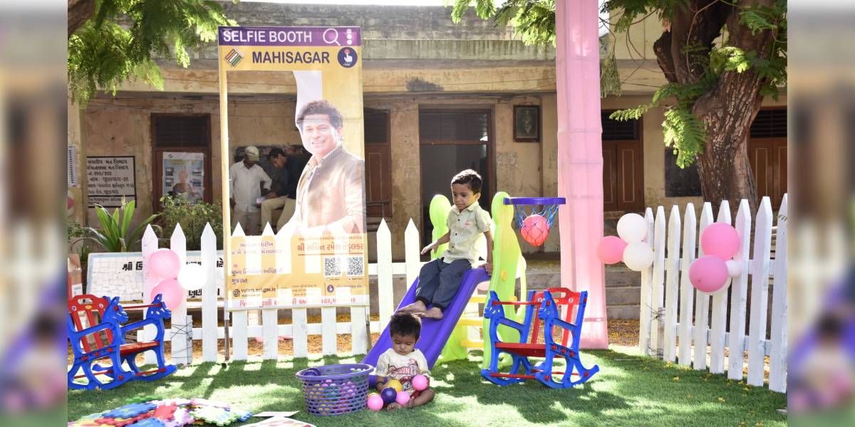 Children at the play area of a model polling station at Lunawada, Gujarat.