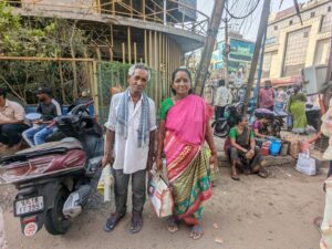 Barla Saraswathi, along with her co-worker Poluru Venkata Narayana, is waiting for work. (South First)